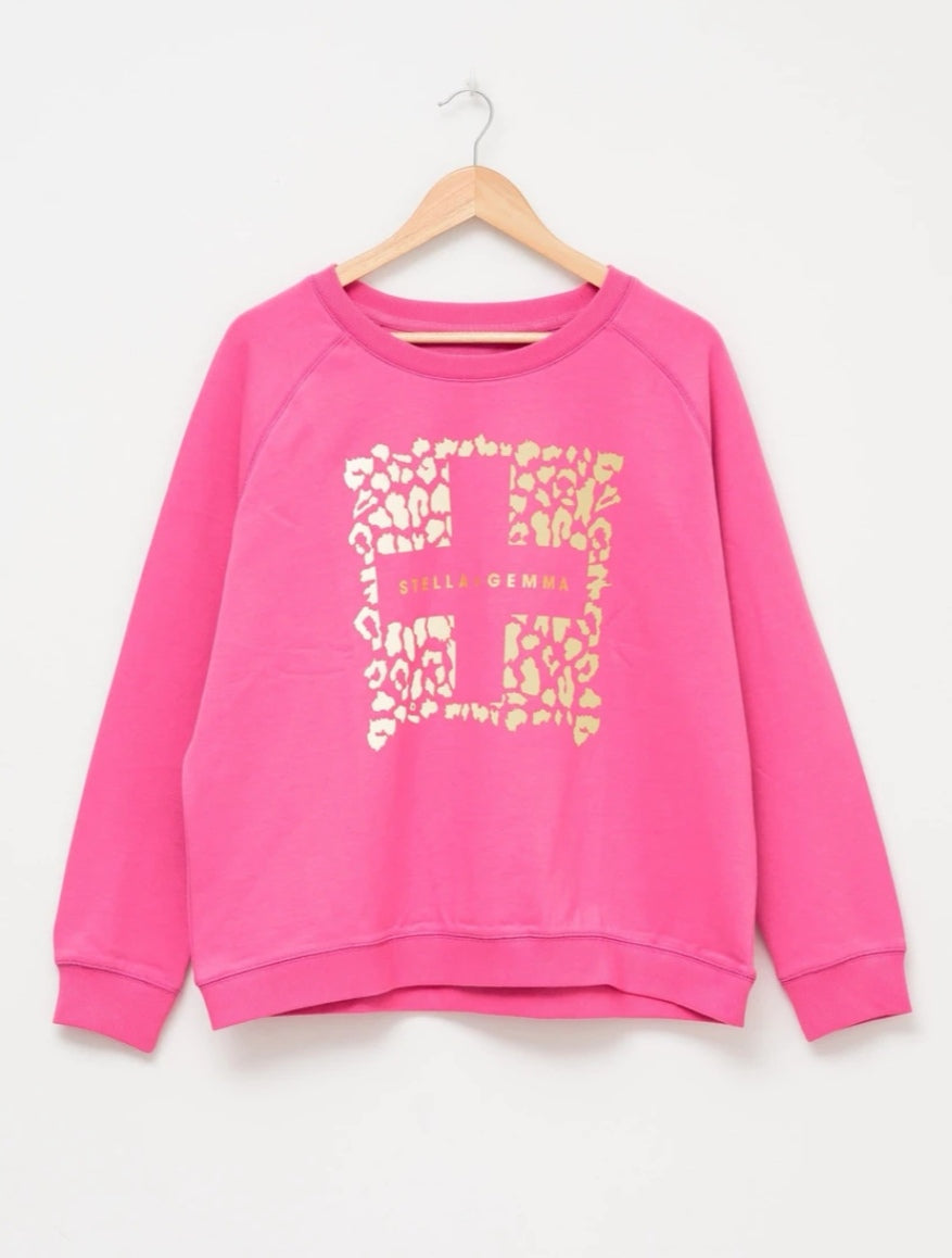 Hot pink sweater w/ gold logo